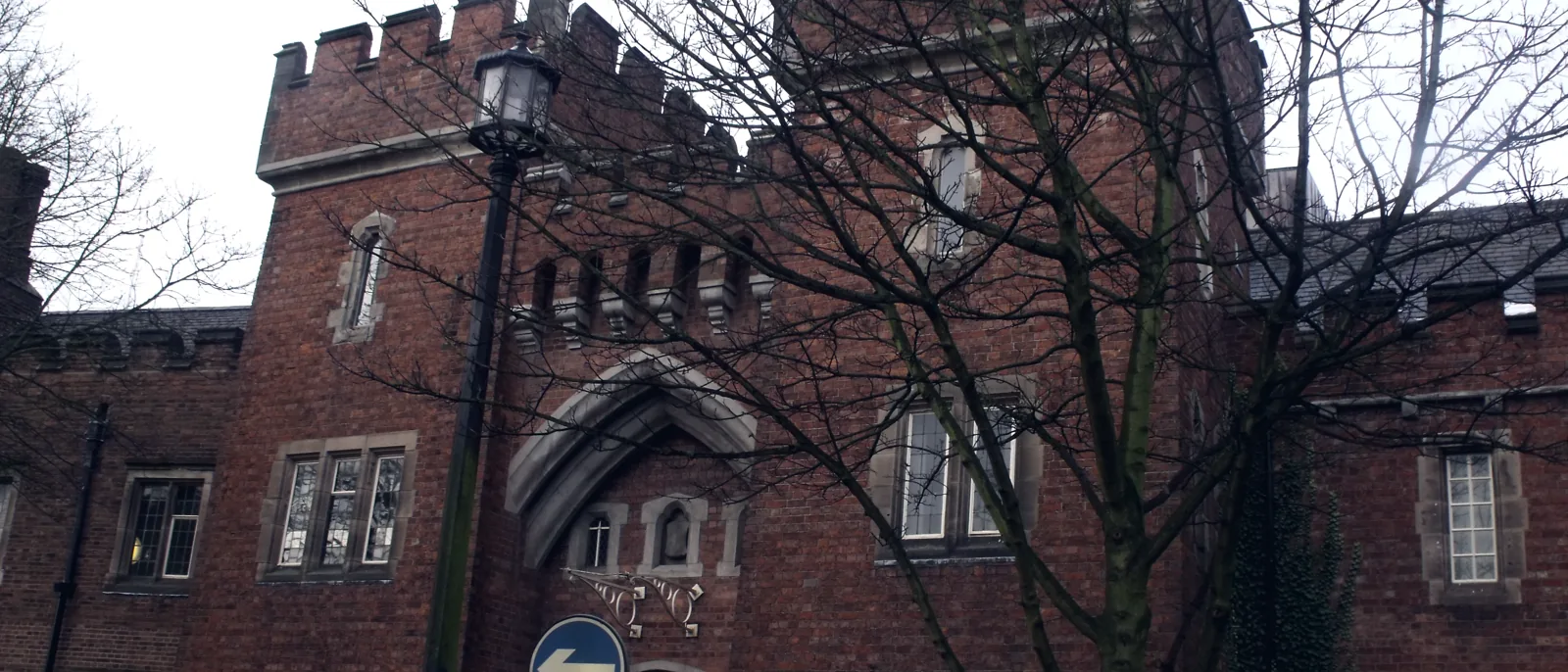 The red-brick, castellated frontage of a Victorian town hall