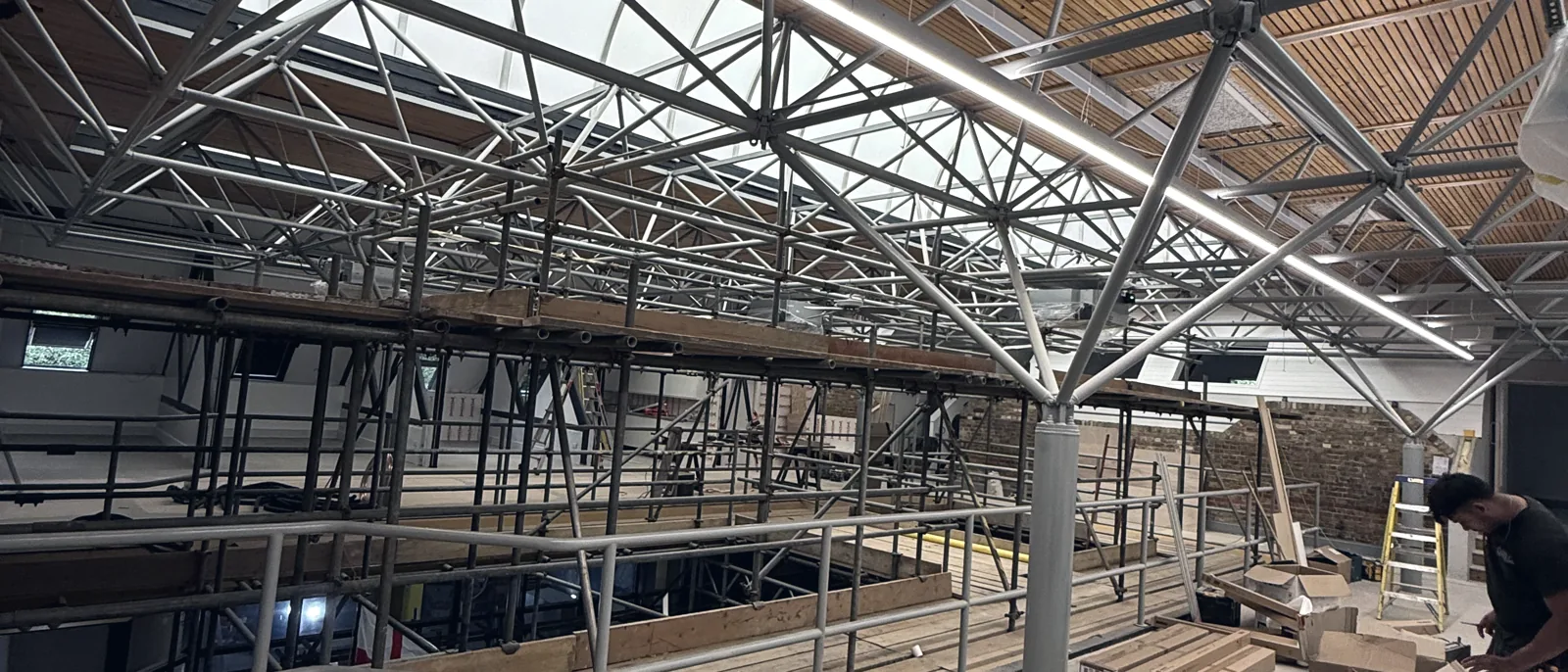 Exposed timber roof structure during works on a listed building